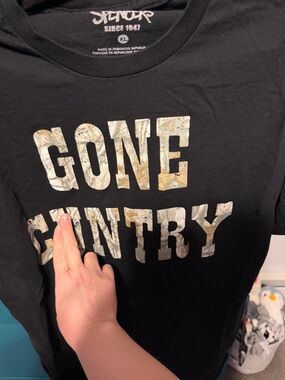 Spencer's Black Graphic Tee with camouflage lettering “gone cuntry” size xl